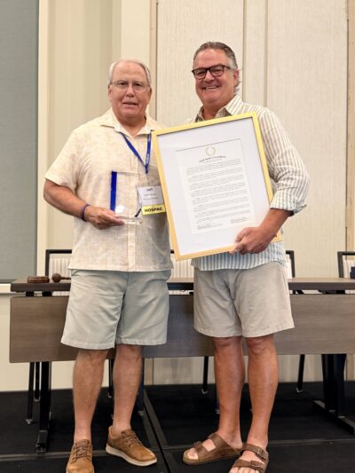 Jeff Brannon receives Gold Medal of Excellence Award from Glenn Sisk